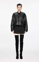 Damen Avantgarde Boxy Daunenjacke mit Leder Optik